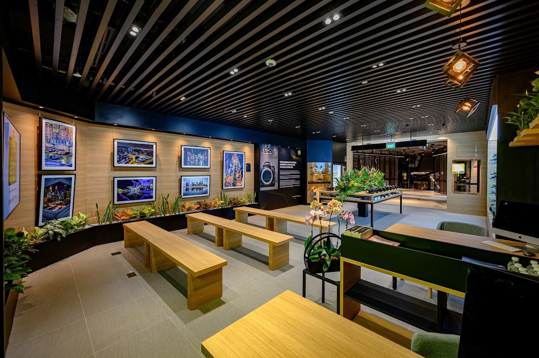 Modern interior of Nikon Experience Hub featuring photo displays, seating, and product showcases.