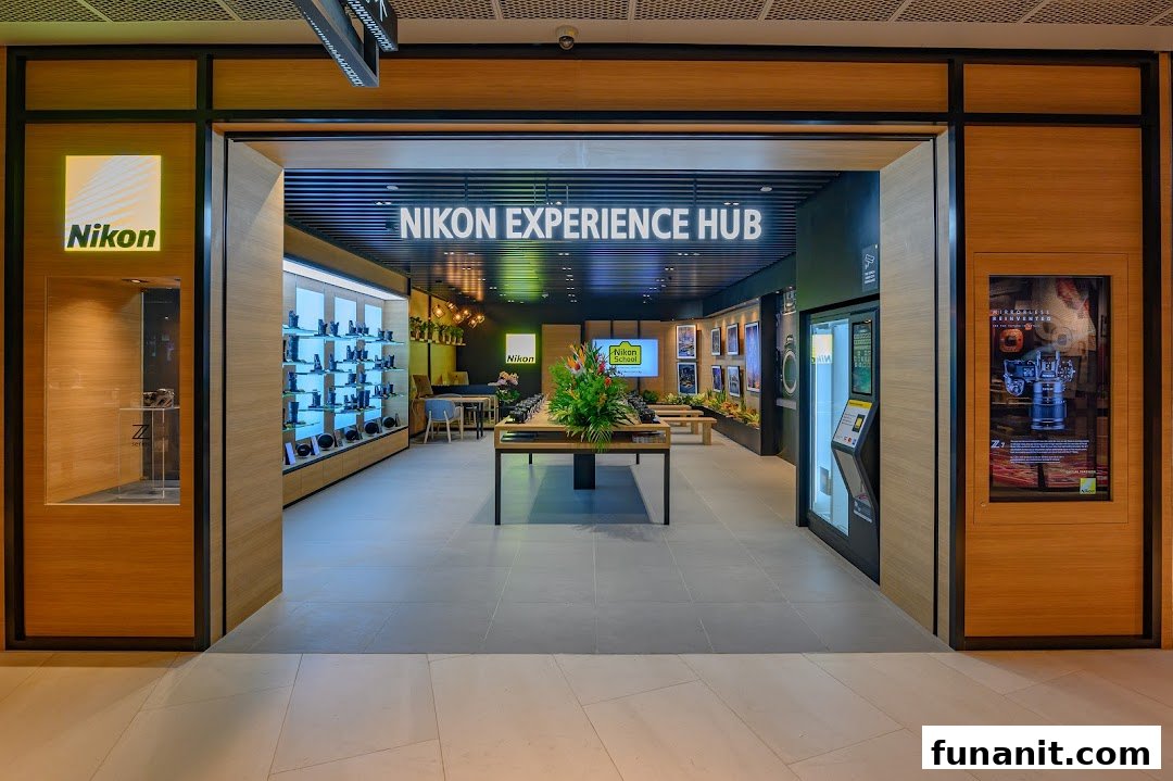The inviting entrance of the Nikon Experience Hub, showcasing cameras and interactive displays.