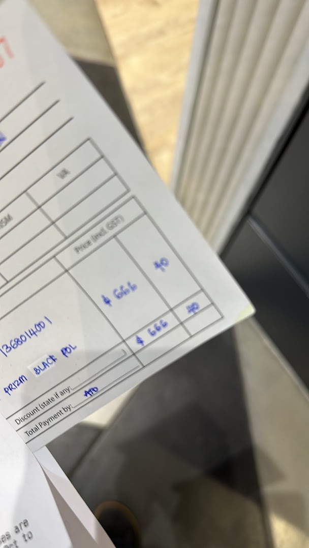 A close-up of an Oakley sales document showing product details like 'PRIZM BLACK POL' and pricing information.