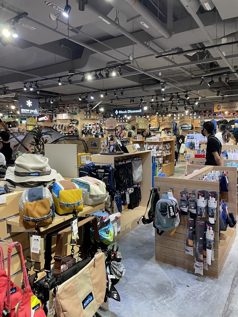 An indoor retail space showcasing a wide range of outdoor gear, apparel, and accessories.
