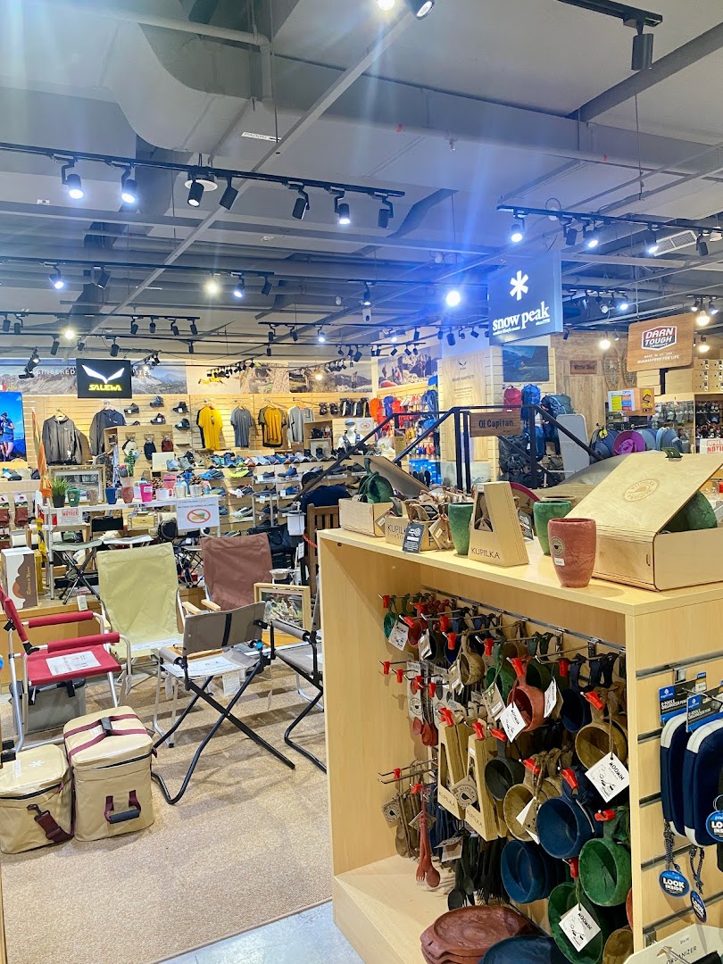 Interior view of Outdoor Life shop, showcasing outdoor apparel, camping gear, and accessories.