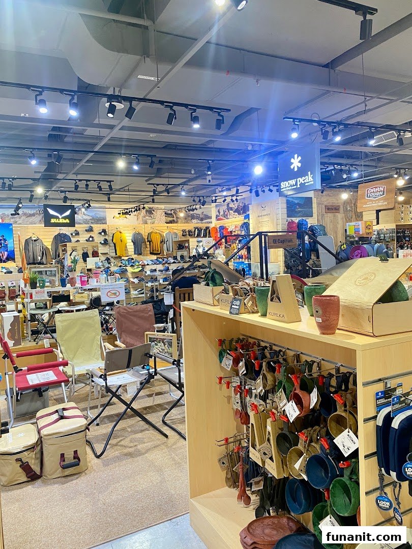 Interior view of Outdoor Life shop, showcasing outdoor apparel, camping gear, and accessories.