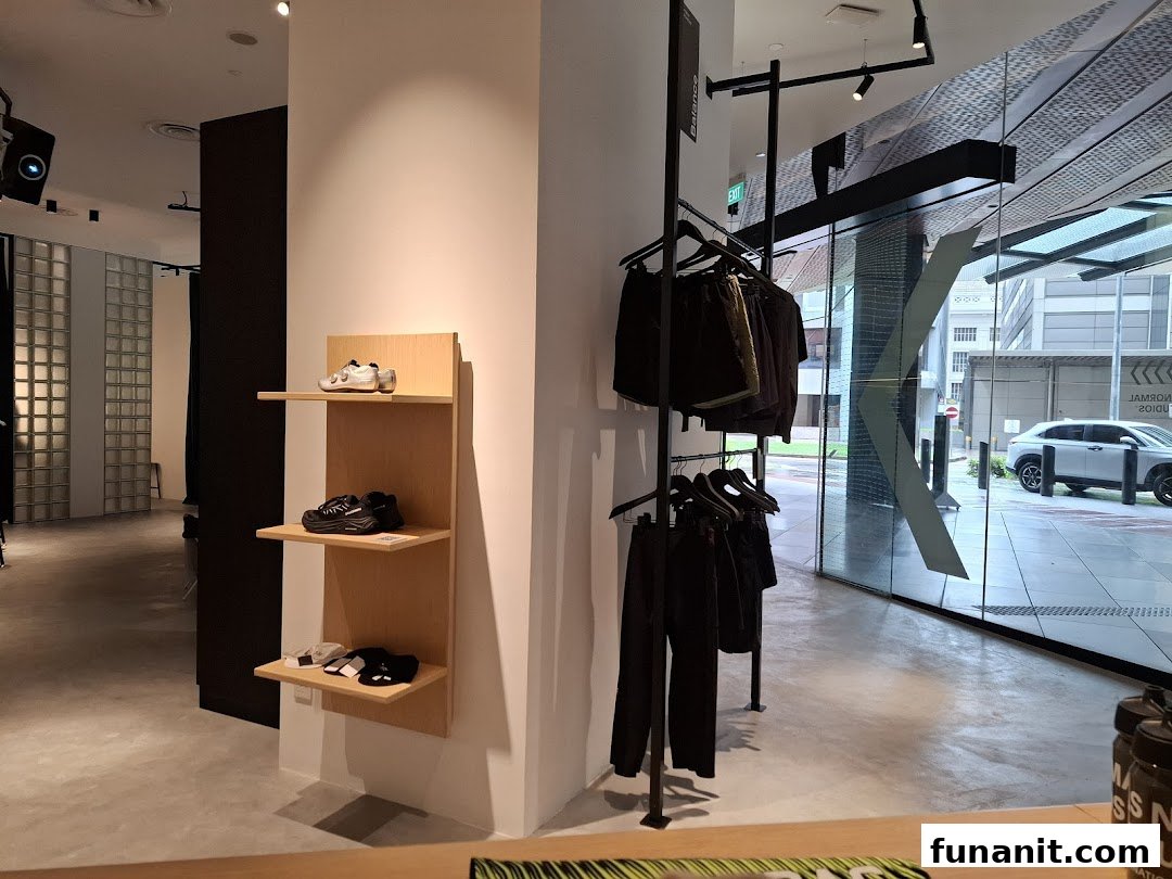 Interior view of Pas Normal Studios Singapore, showcasing cycling apparel, footwear, and accessories.
