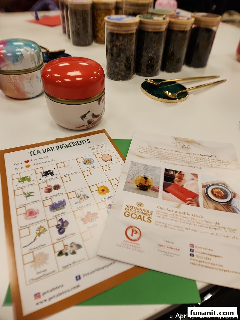 A display of Pétale Tea products, including tea jars, decorative tins, and informational flyers.