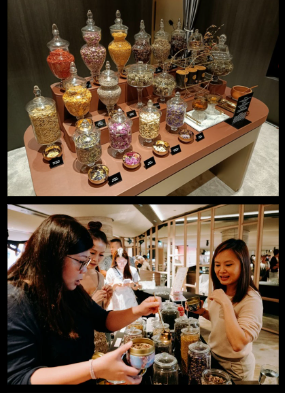 A vibrant display of various tea ingredients in glass jars, with customers engaging with the products.