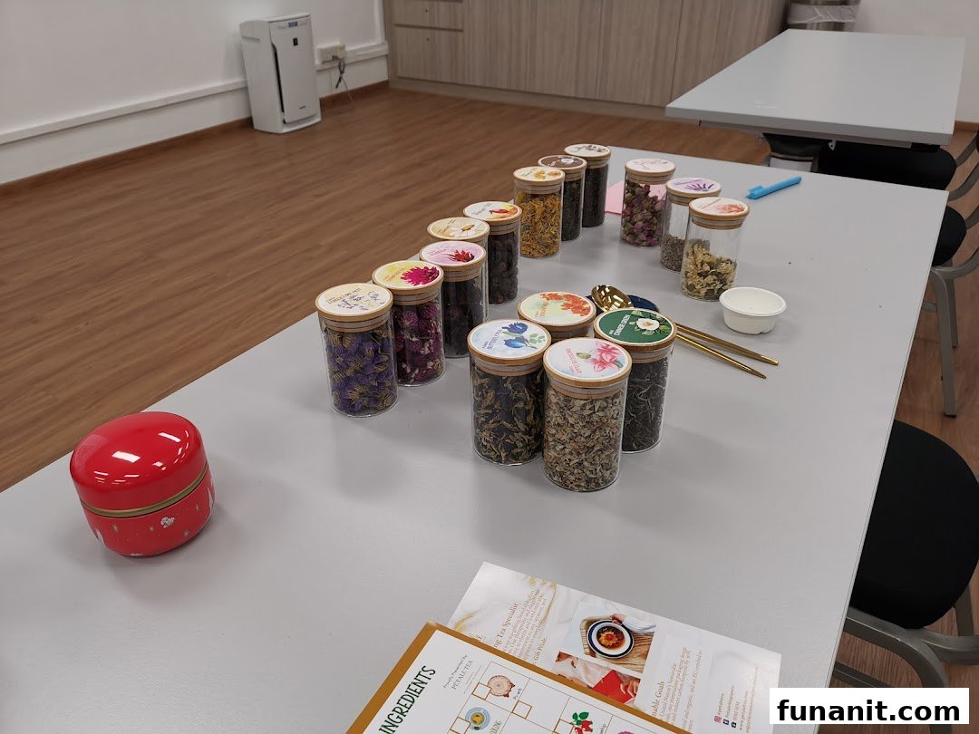 A table displays numerous jars filled with dried flowers and tea leaves, set up for a tea blending activity.