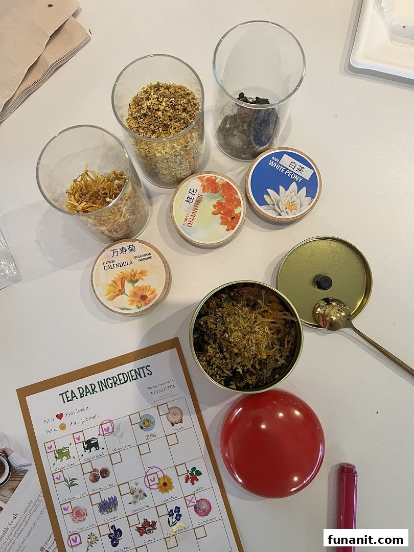 A vibrant display of dried tea ingredients and a 'Tea Bar Ingredients' sheet for custom blending.