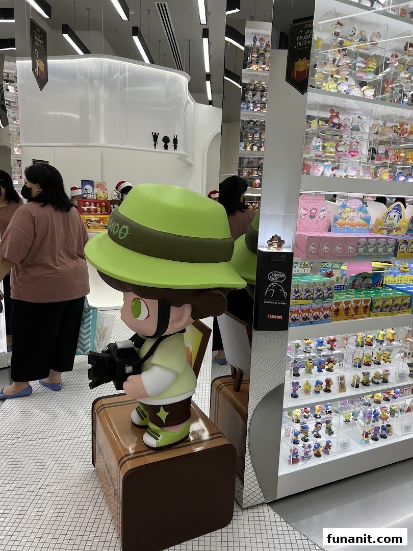 Interior view of POP MART Funan, featuring a large display figure and shelves filled with collectible toys.