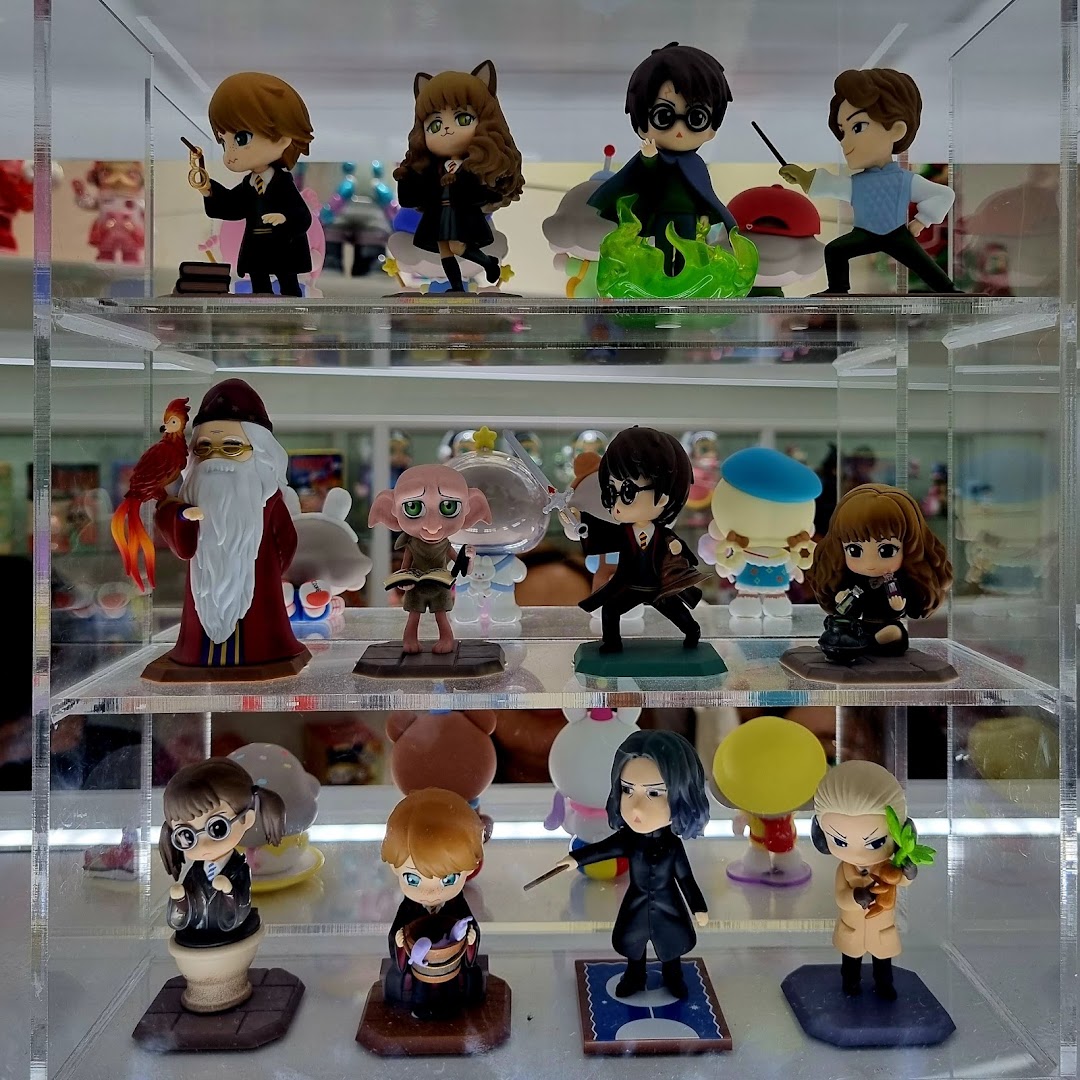 A clear display case showcasing various detailed Harry Potter themed collectible figurines.