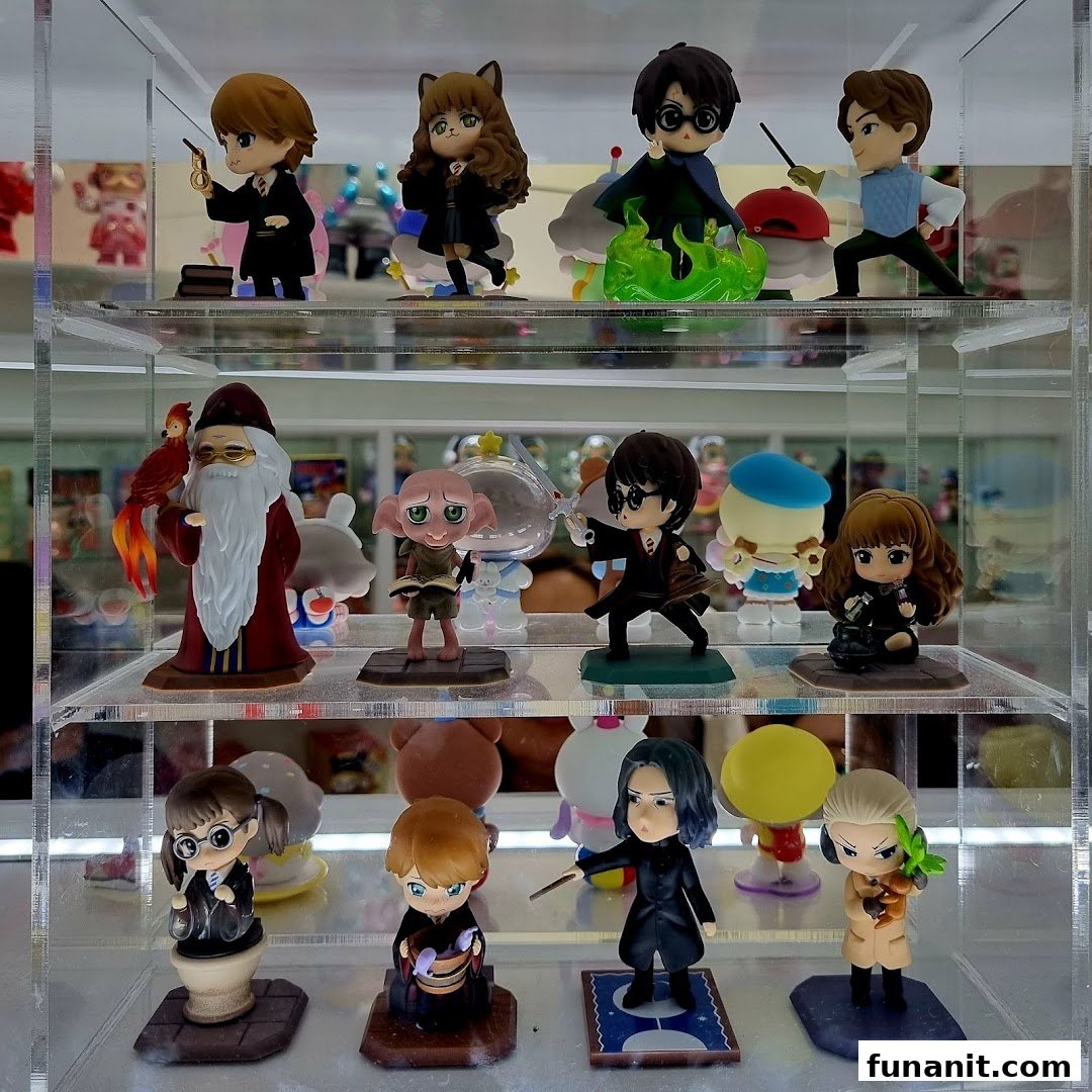 A clear display case showcasing various detailed Harry Potter themed collectible figurines.