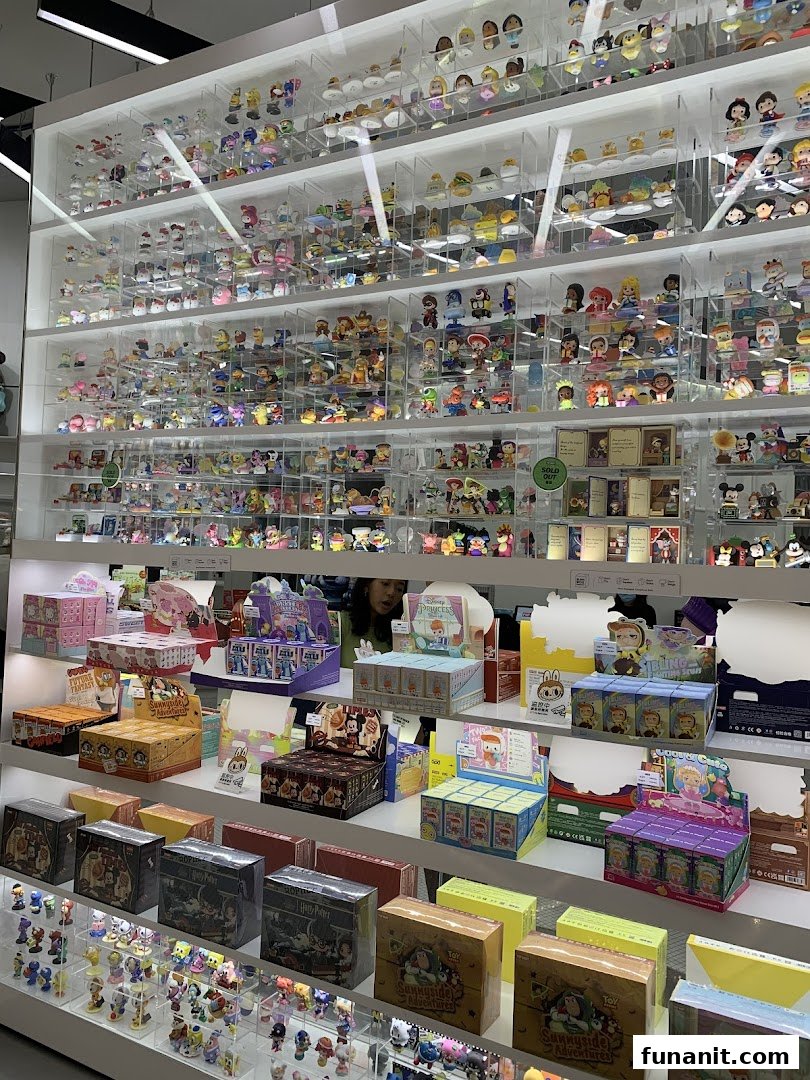 Shelves filled with a vast collection of colorful collectible figurines and blind boxes at POP MART.