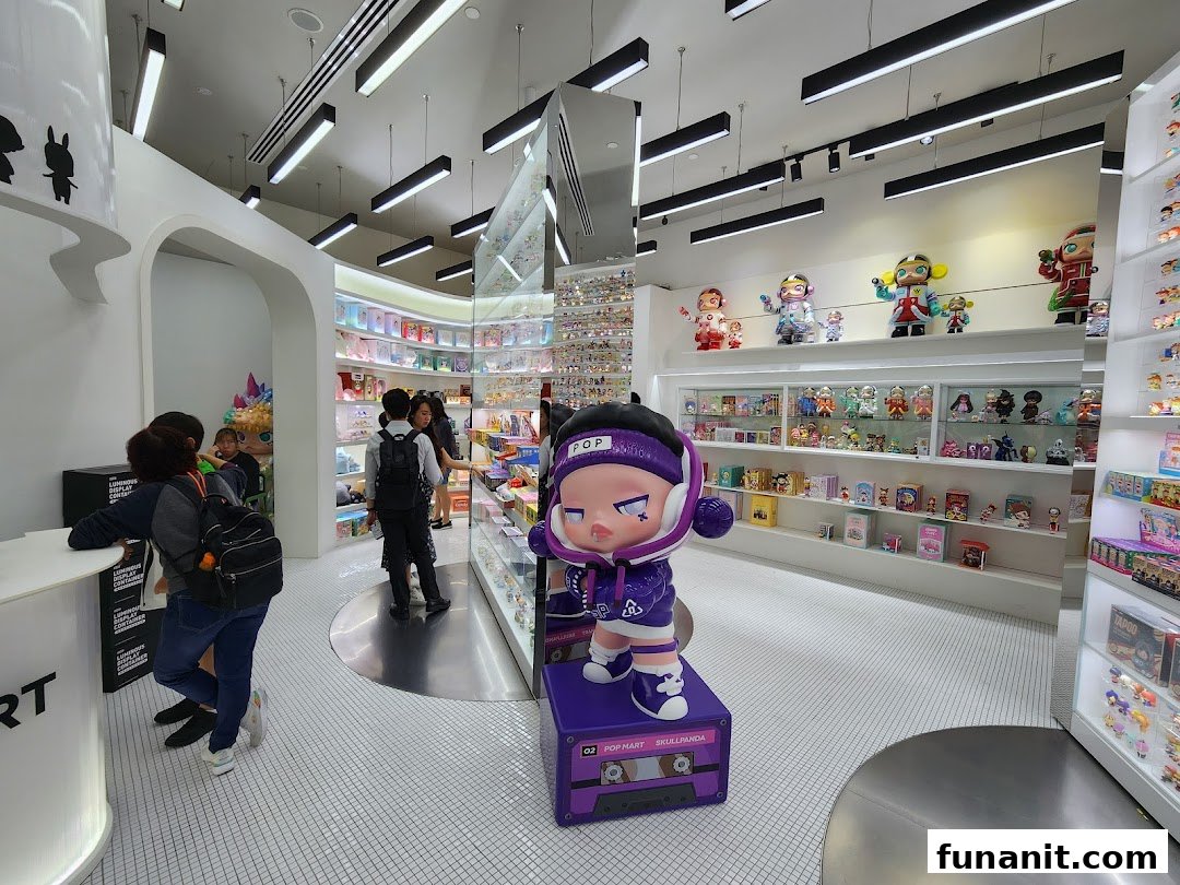 Interior view of POP MART Funan, showcasing collectible art toys, figurines, and a large Skullpanda statue.