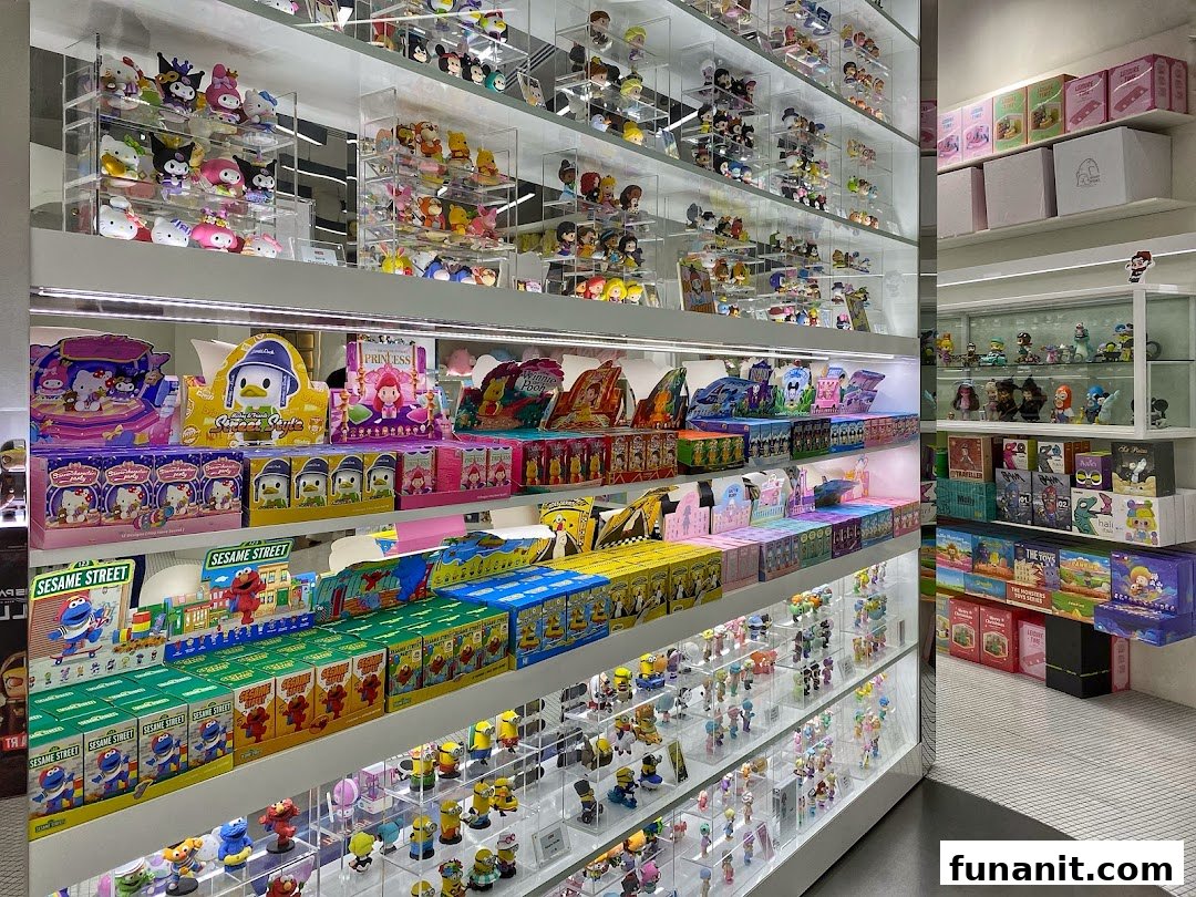 Shelves filled with diverse collectible toys, blind boxes, and character merchandise at POP MART.