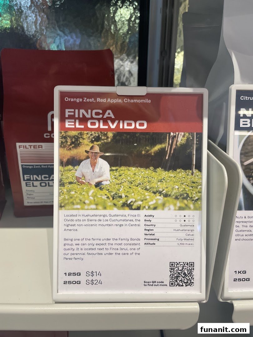 A detailed display card for Finca El Olvido coffee beans, showing origin, tasting notes, and pricing.