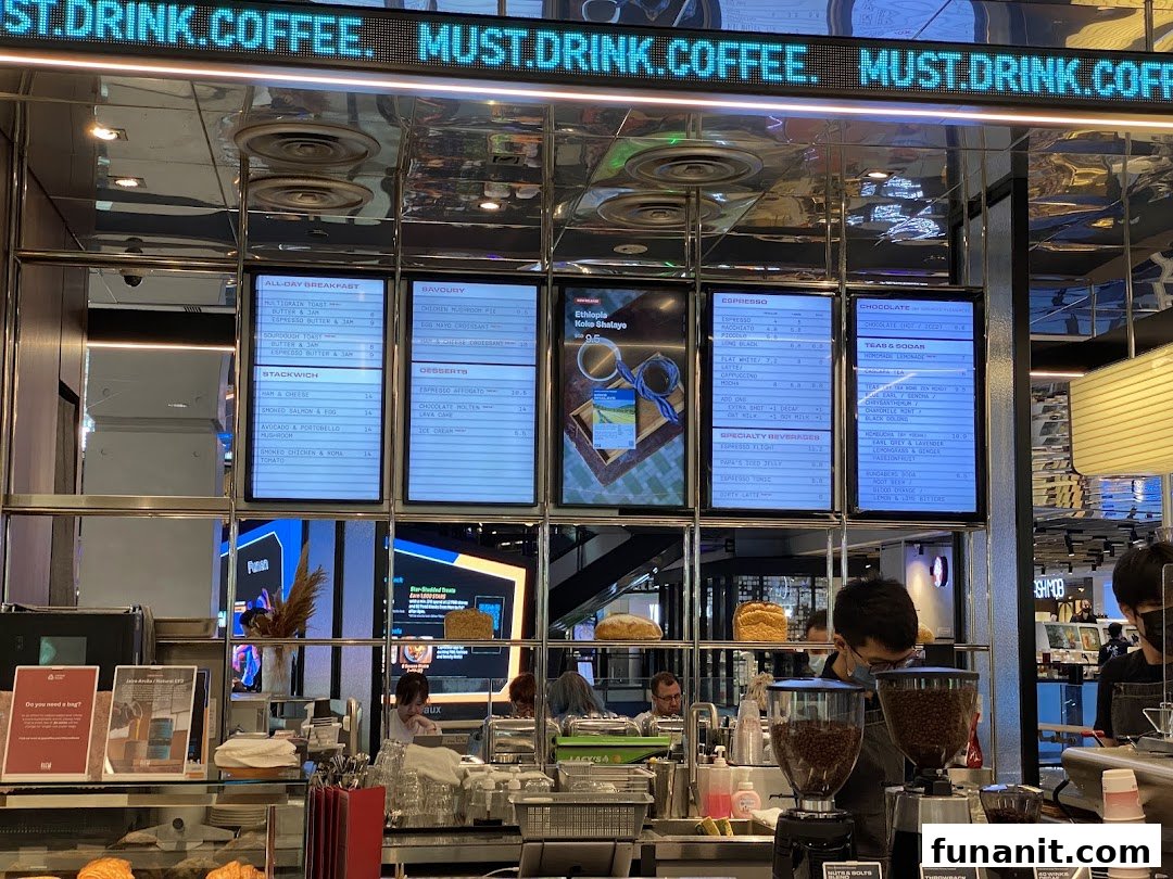 Digital menu boards displaying coffee, breakfast, and snack options at PPP Coffee.