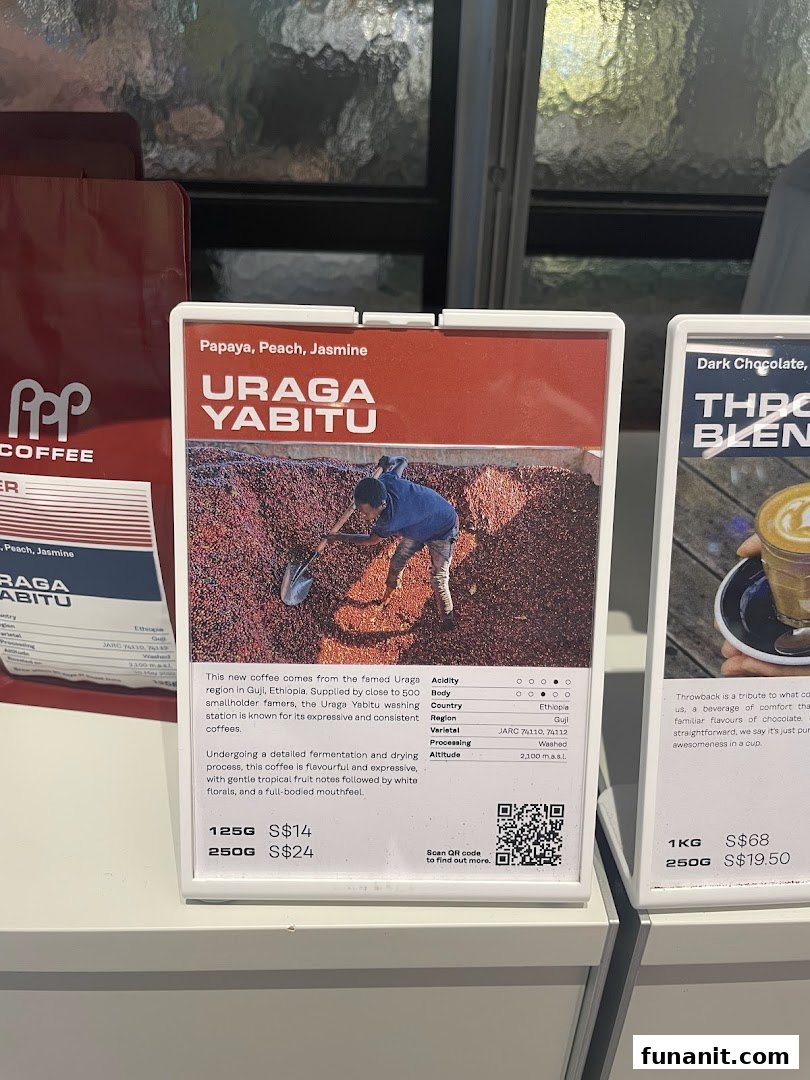 Close-up of coffee bean product displays, featuring Uraga Yabitu and Throwback blends with detailed descriptions and prices.