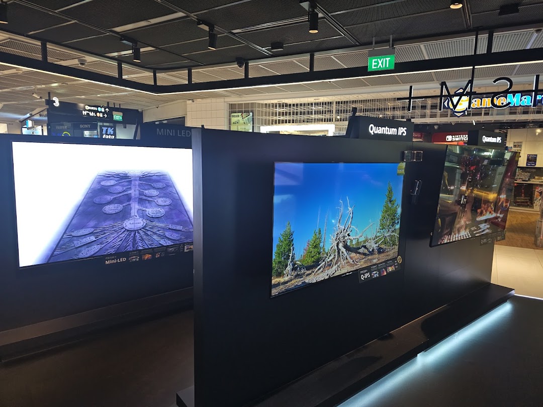 Interior view of PRISM Funan, showcasing large display screens with Mini-LED and Quantum IPS technologies.