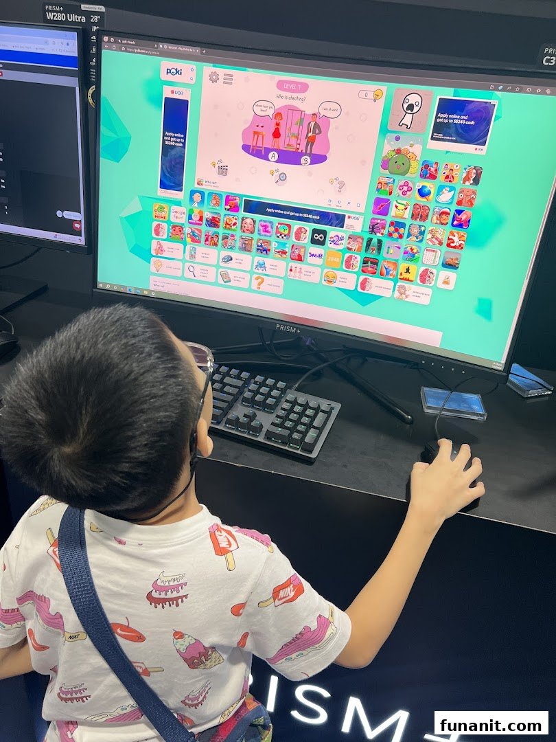 A child plays a game on a large PRISM+ monitor display inside the store.