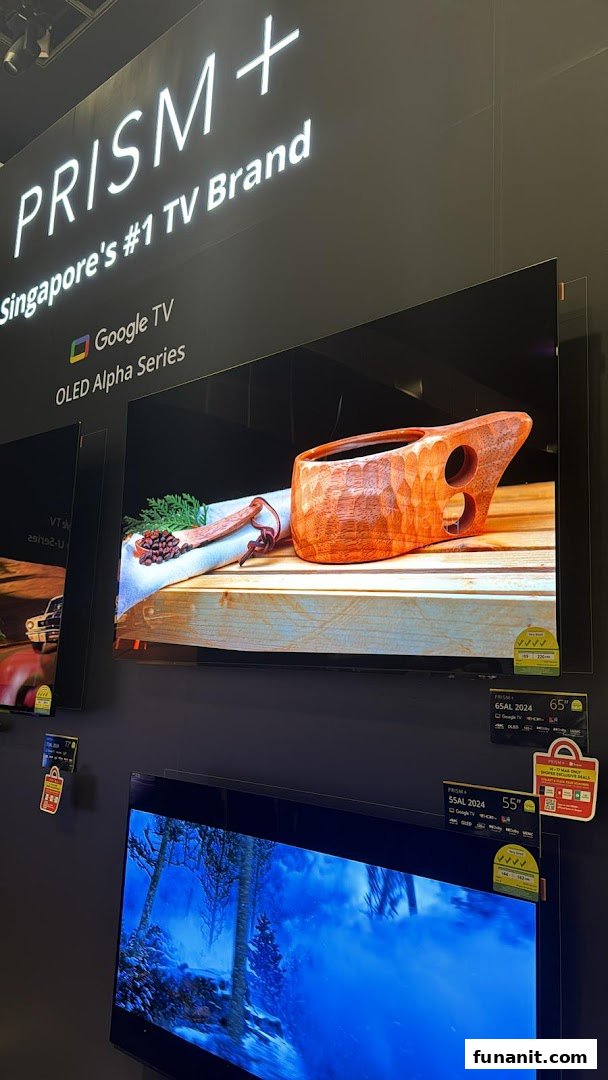 A display of PRISM+ OLED Alpha Series TVs showcasing vibrant visuals in a retail setting.