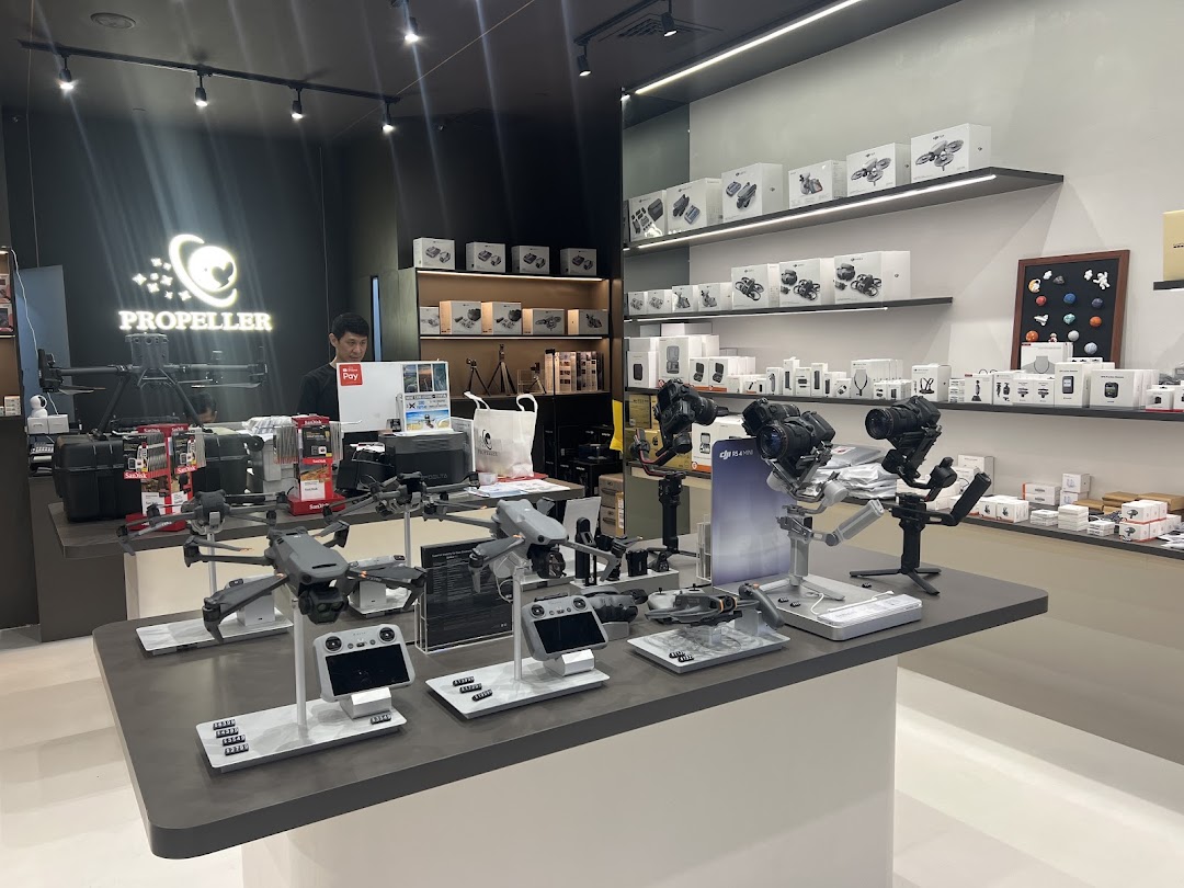 Interior view of Propeller - Funan, showcasing drones, cameras, and accessories on display.