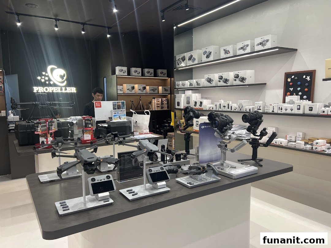 Interior view of Propeller - Funan, showcasing drones, cameras, and accessories on display.