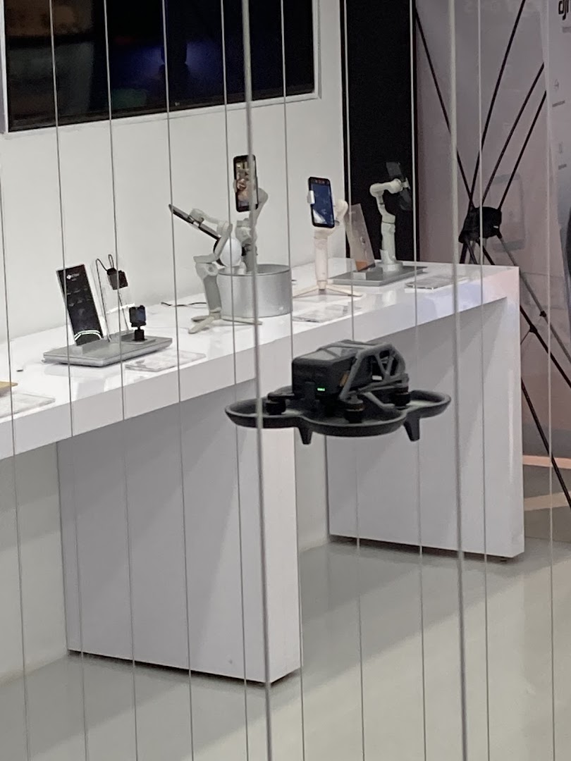 An interior shot of Propeller - Funan, showcasing drones, phone gimbals, and other tech accessories on display.