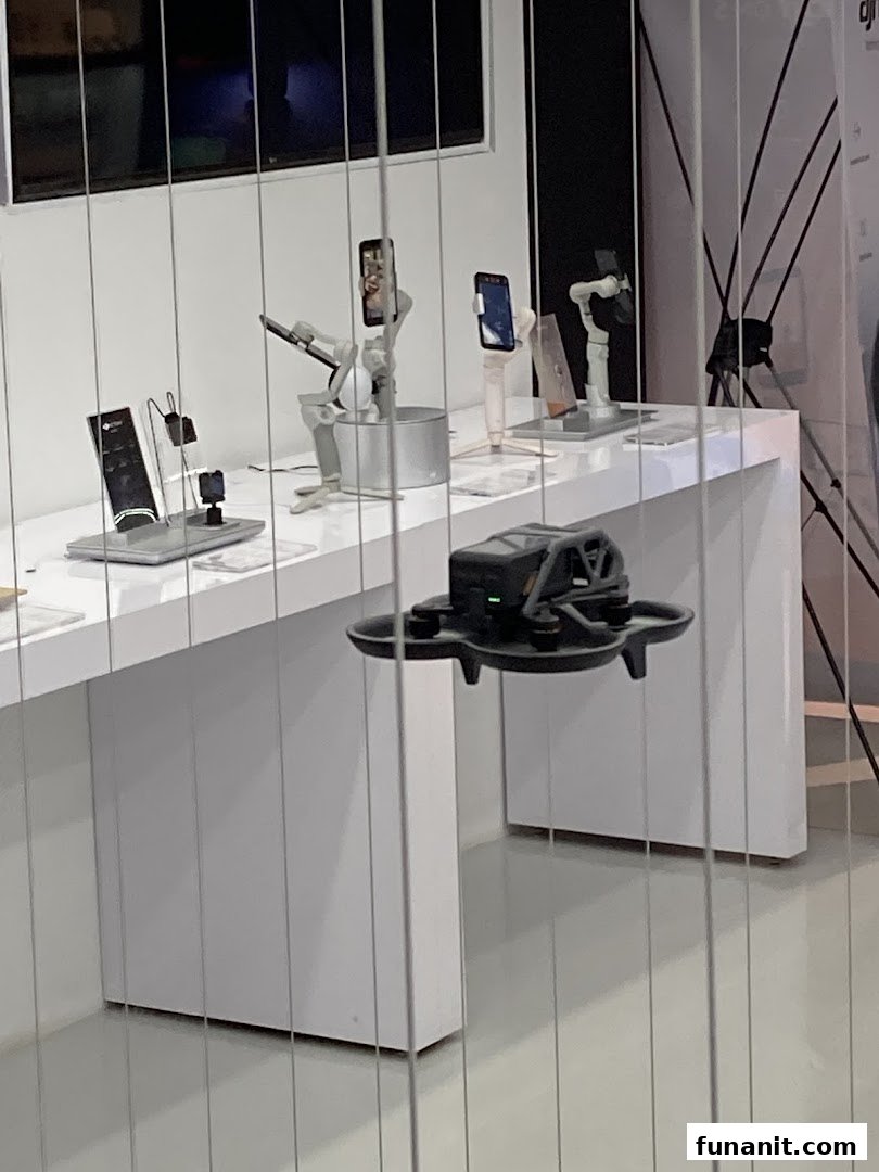 An interior shot of Propeller - Funan, showcasing drones, phone gimbals, and other tech accessories on display.