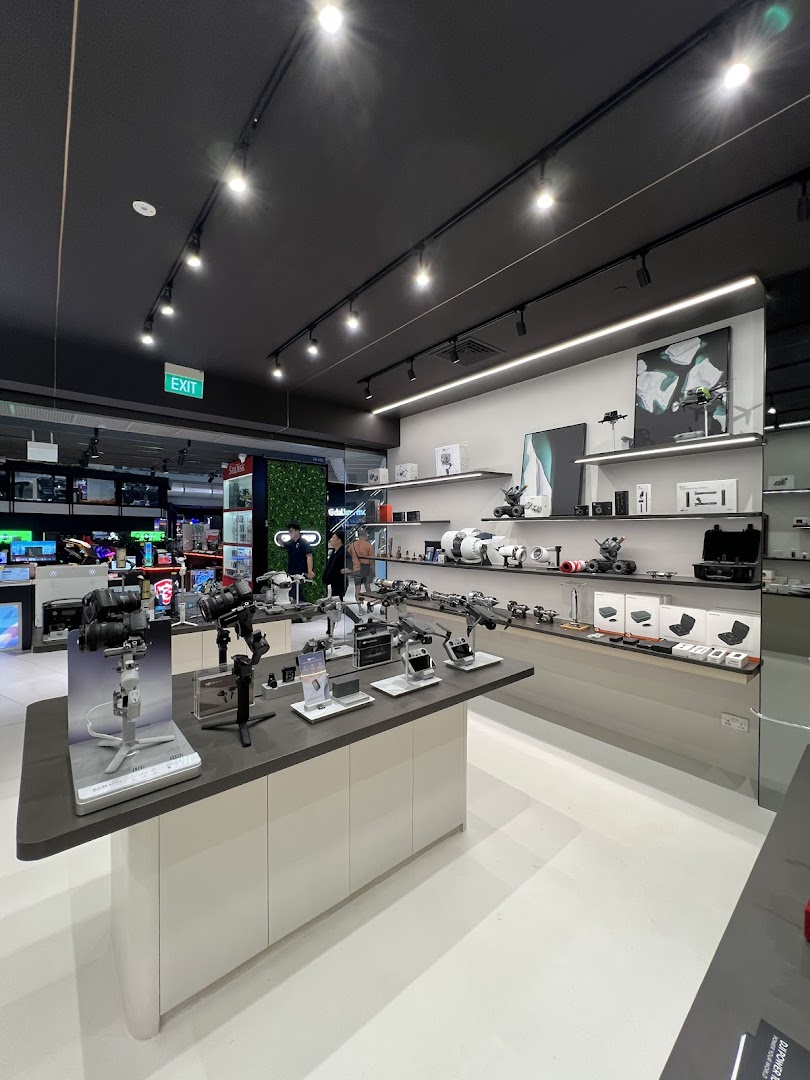 An interior view of Propeller - Funan, showcasing a wide array of modern tech gadgets and camera equipment on display.