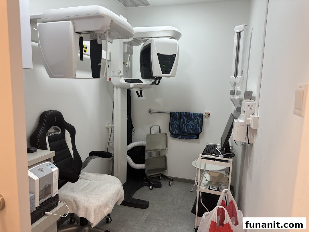 Interior view of a modern dental clinic examination room with advanced imaging equipment.