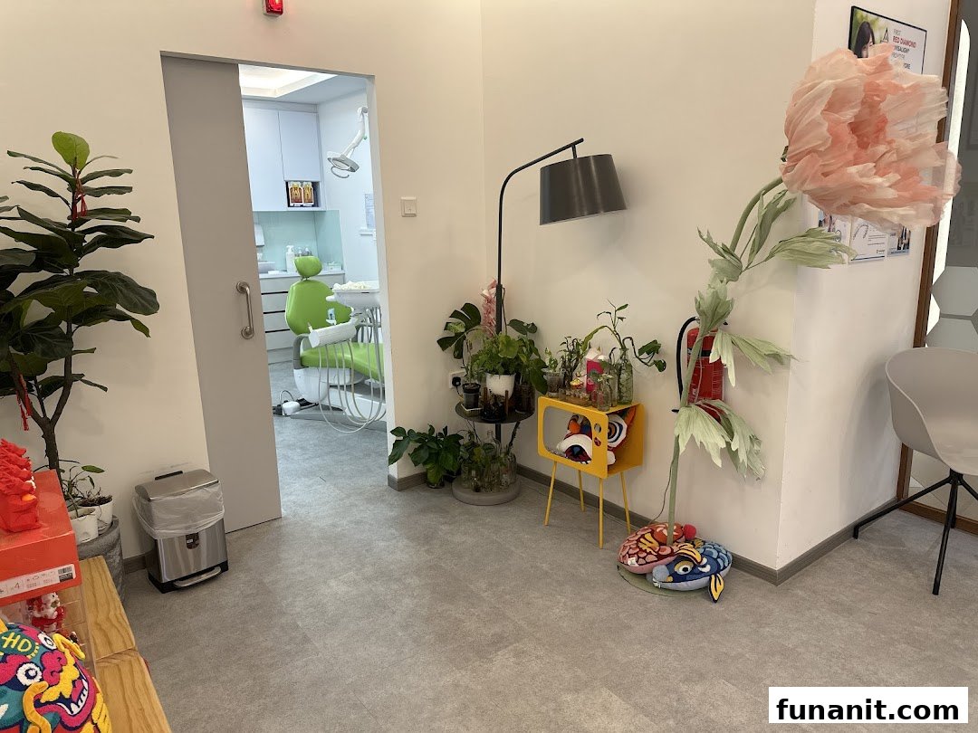A modern dental clinic interior, showing a waiting area with a glimpse into a treatment room.