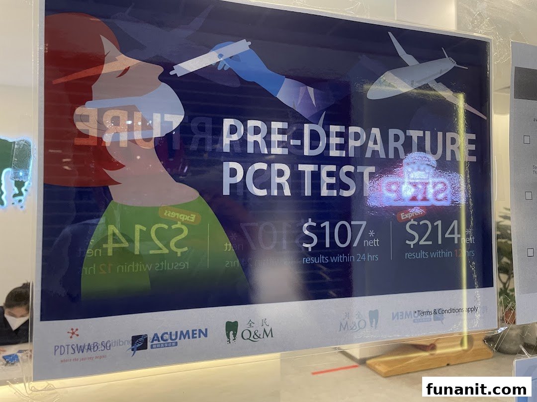 A sign advertising pre-departure PCR tests with pricing and turnaround times at Q&M Dental Centre.