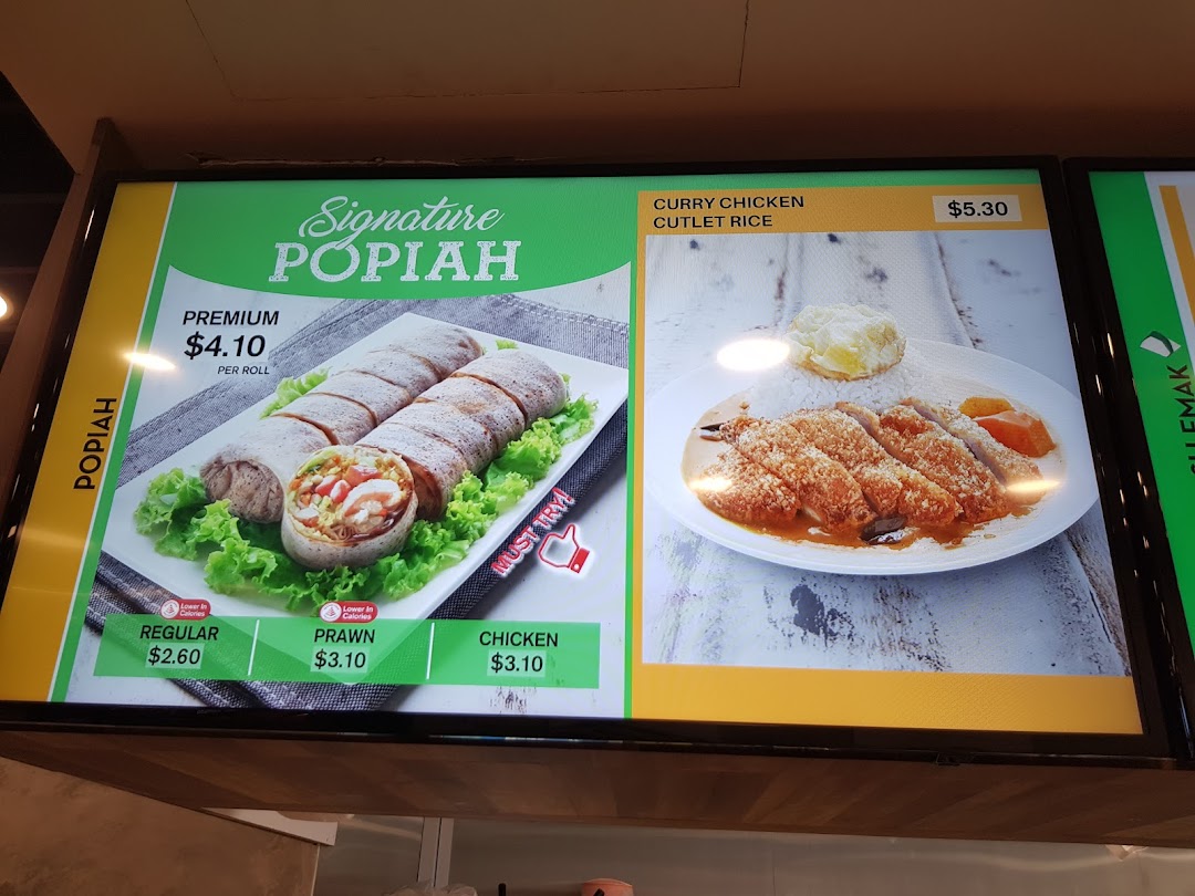 A vibrant menu board showcasing Popiah varieties and Curry Chicken Cutlet Rice at Qi Ji.