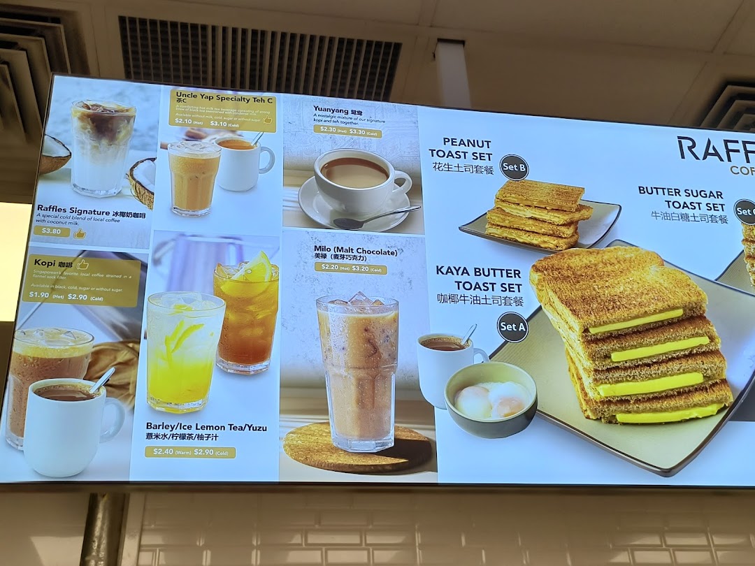 A digital menu board displaying various coffee, tea, and toast sets with prices and images.