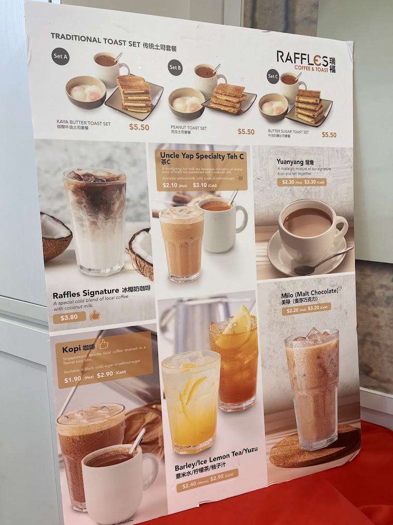 A detailed menu board for Raffles Coffee and Toast, showcasing traditional toast sets and various local beverages.