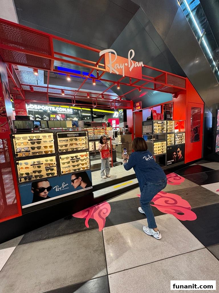 The vibrant red exterior of Ray-Ban Funan showcasing a wide array of sunglasses and optical frames.