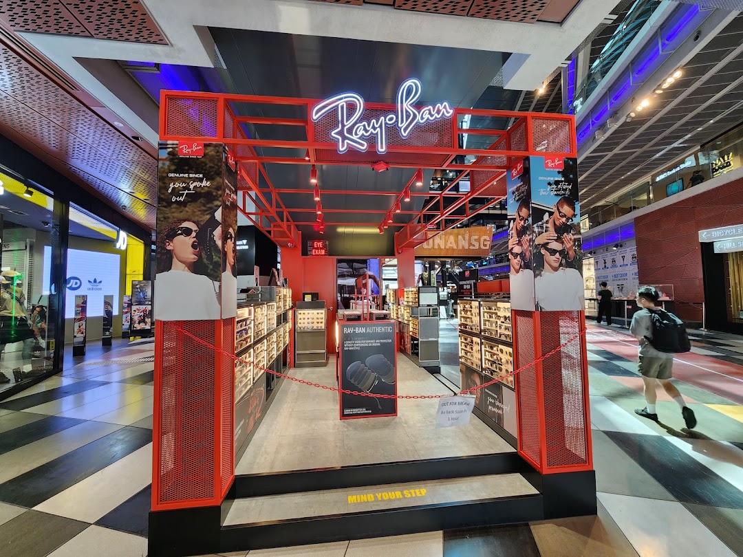 The Ray-Ban Funan shop entrance features prominent branding, eyewear displays, and promotional signage.