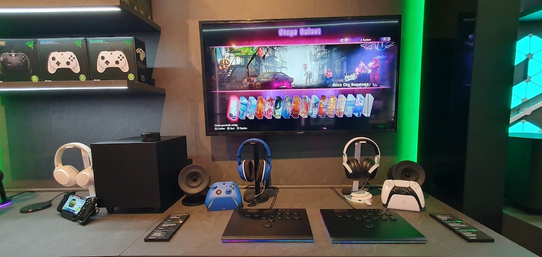 A vibrant Razer store interior showcasing gaming peripherals, demo stations, and product displays.