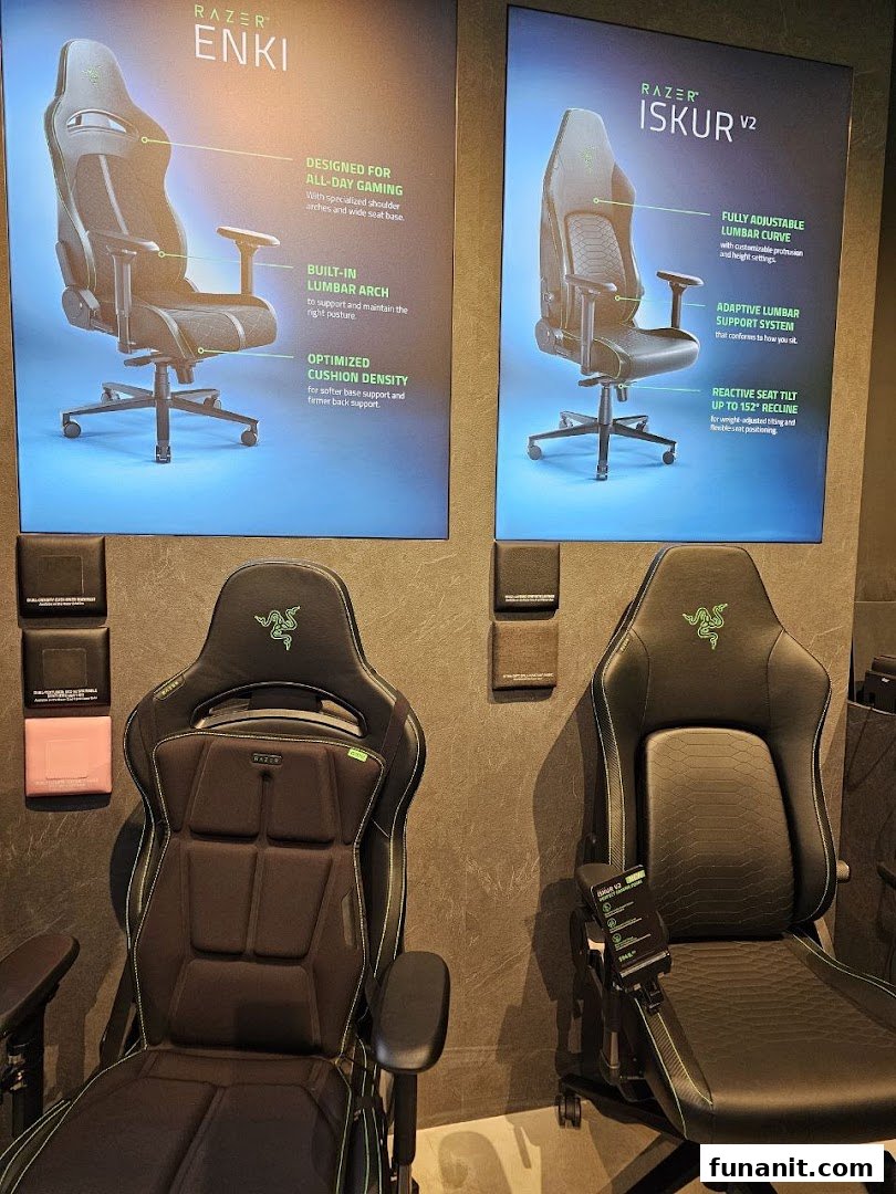 Two Razer gaming chairs, Enki and Iskur V2, displayed with feature posters in-store.