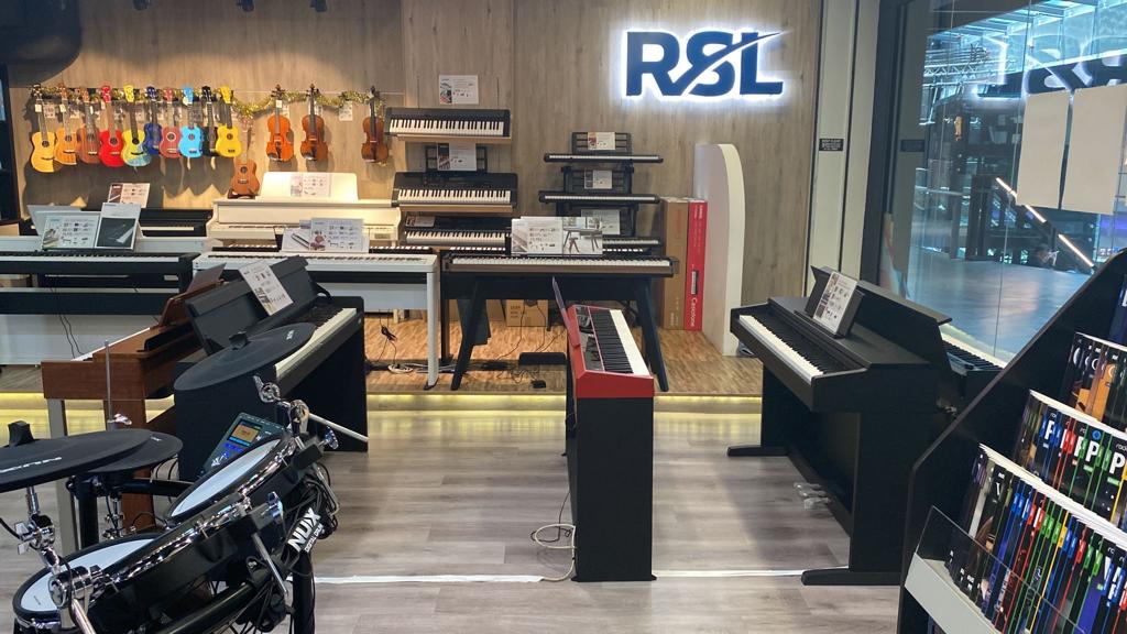 An interior view of Rockschool, RSL London, showcasing a wide range of musical instruments.