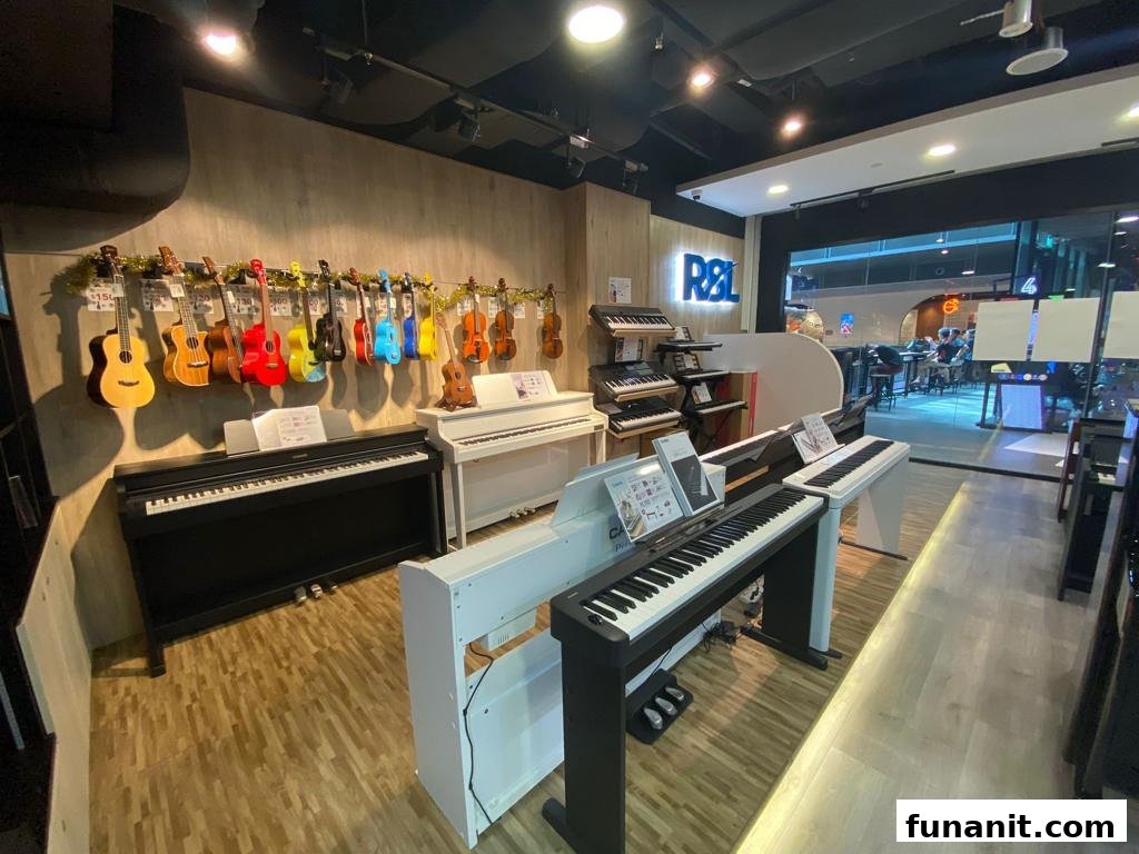 An interior view of a music store showcasing a wide array of pianos, keyboards, ukuleles, and violins.