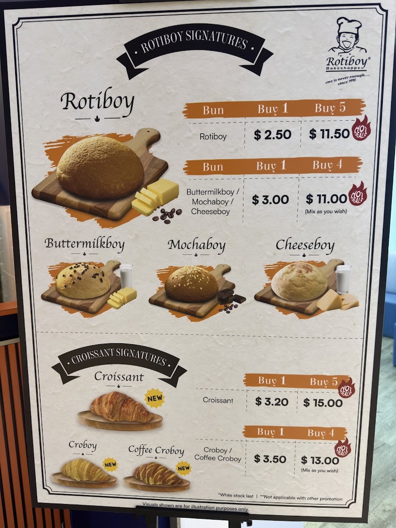A vibrant menu board showcasing Rotiboy's signature buns and croissants with prices and deals.