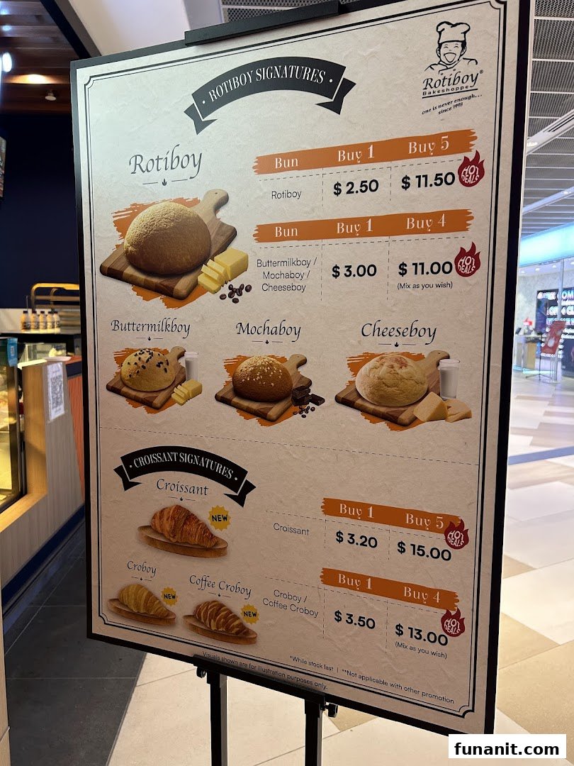 A menu board for Rotiboy Bakeshoppe displaying prices and deals for their signature buns and croissants.
