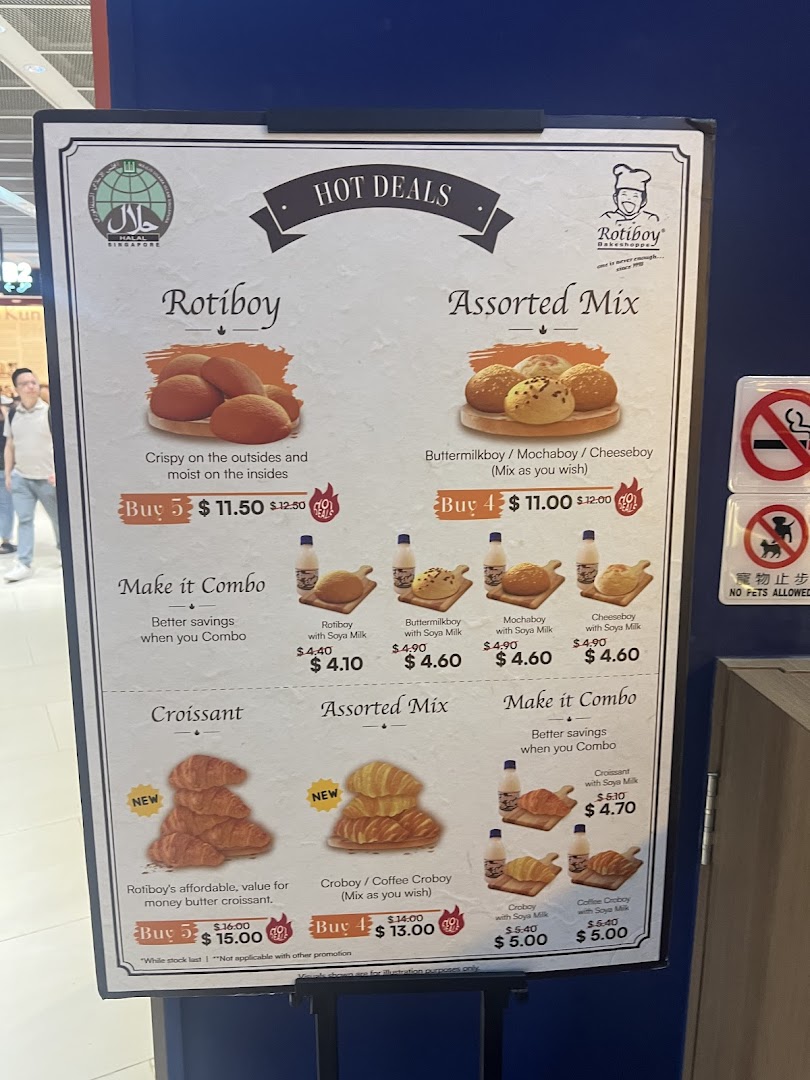 A menu board displaying hot deals and combo options for Rotiboy's signature buns and croissants.