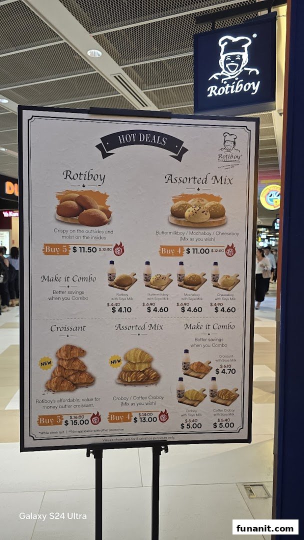 A menu board for Rotiboy showcasing hot deals and combo offers on their signature buns and croissants.