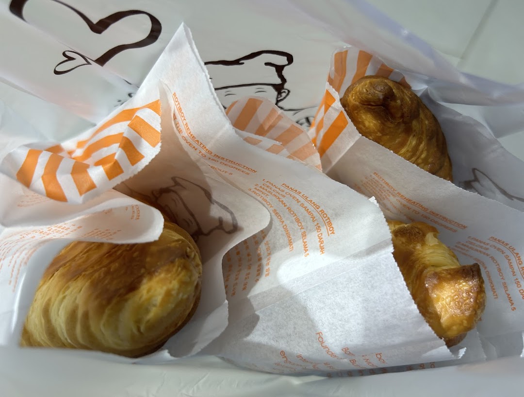 Freshly baked pastries from Rotiboy, individually wrapped in a branded bag.