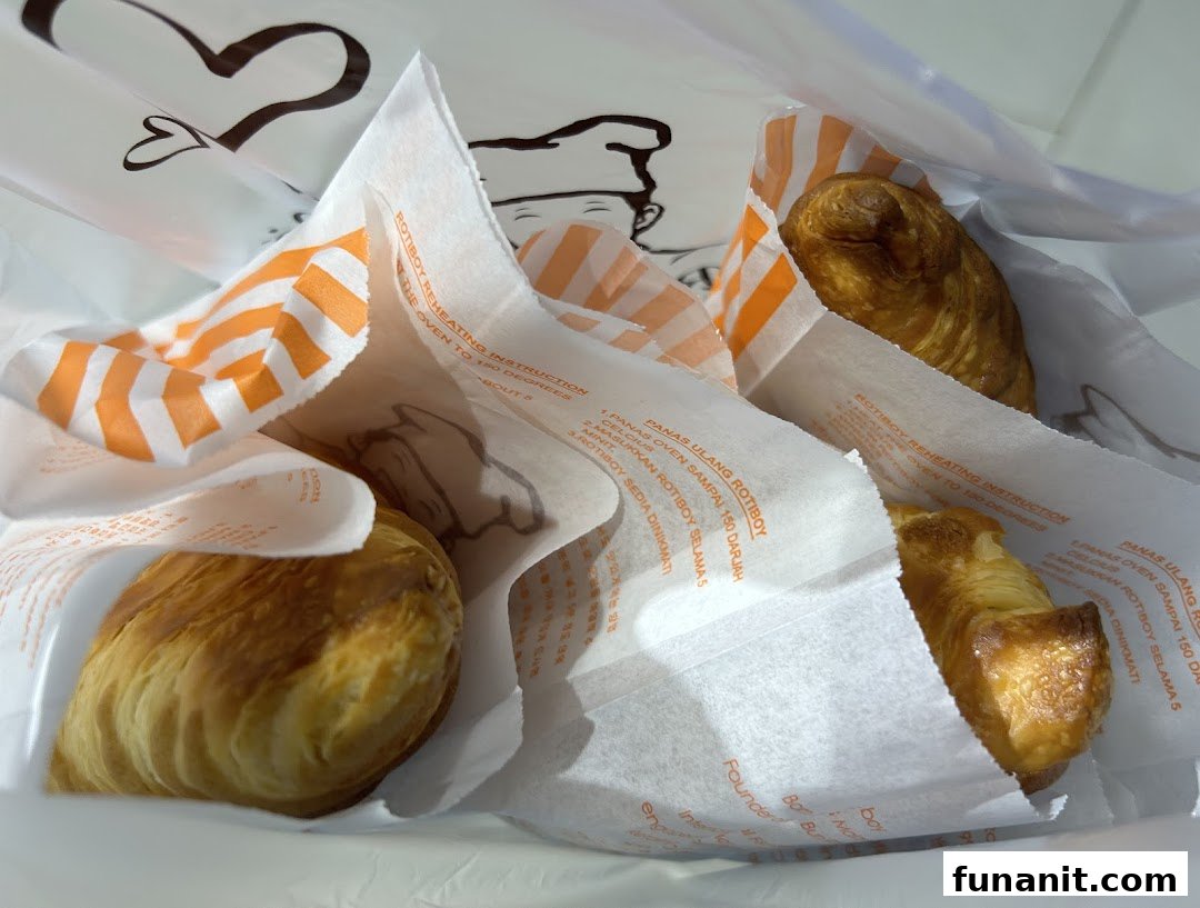 Freshly baked pastries from Rotiboy, individually wrapped in a branded bag.