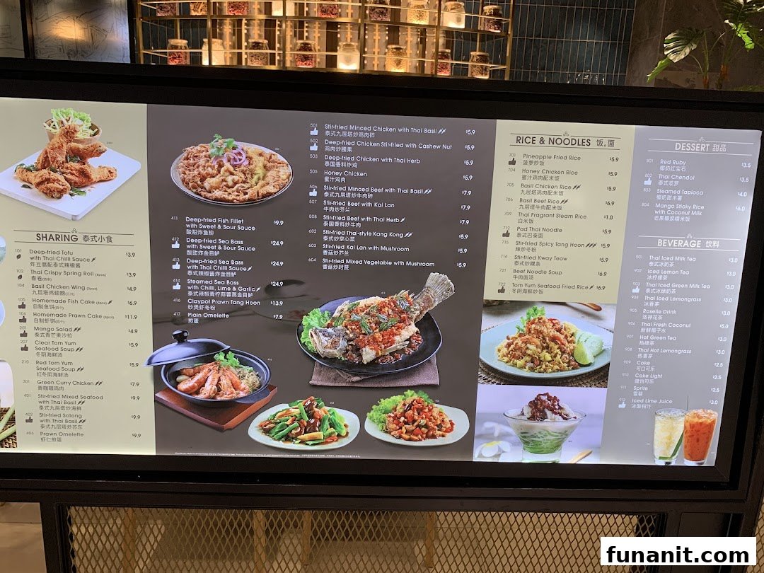 A vibrant digital menu display showcasing a wide array of Thai dishes and beverages with appealing food photography.
