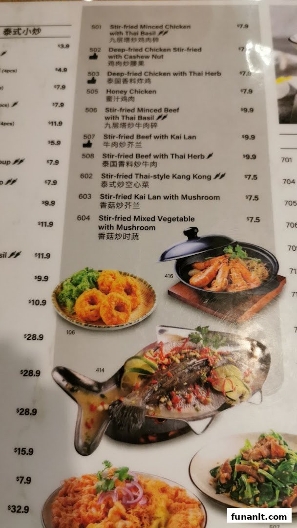 A close-up view of Sanook Kitchen's menu, showcasing a variety of Thai stir-fried dishes with prices.