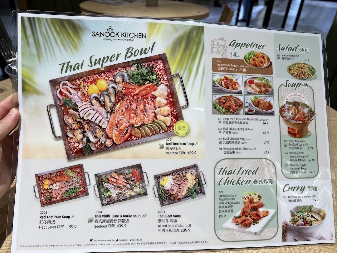 A detailed menu from Sanook Kitchen showcasing Thai Super Bowls, appetizers, salads, soups, fried chicken, and curries.