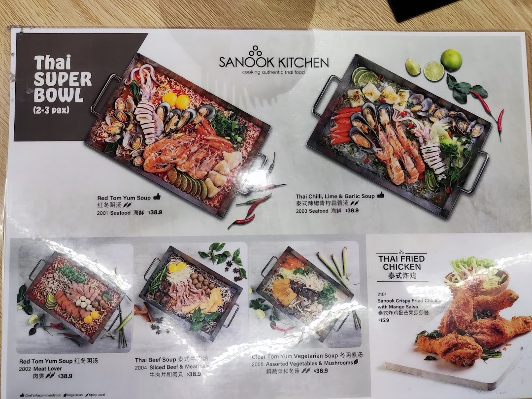 A vibrant menu displaying various Thai Super Bowl options and crispy fried chicken.